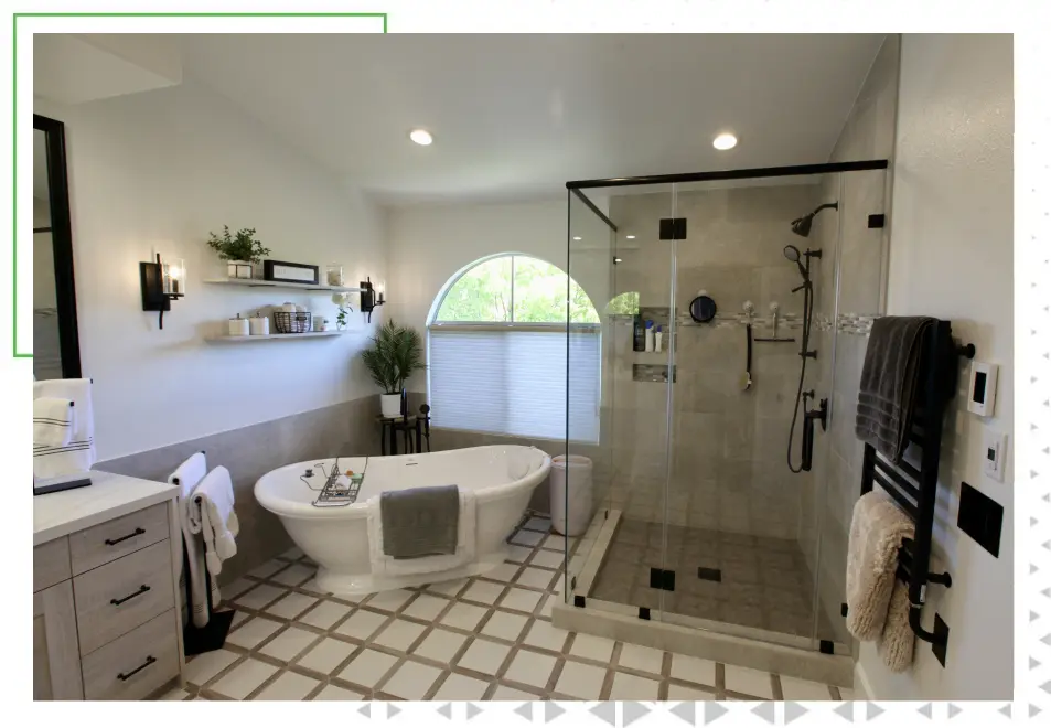 A bathroom with a large tub and walk in shower.